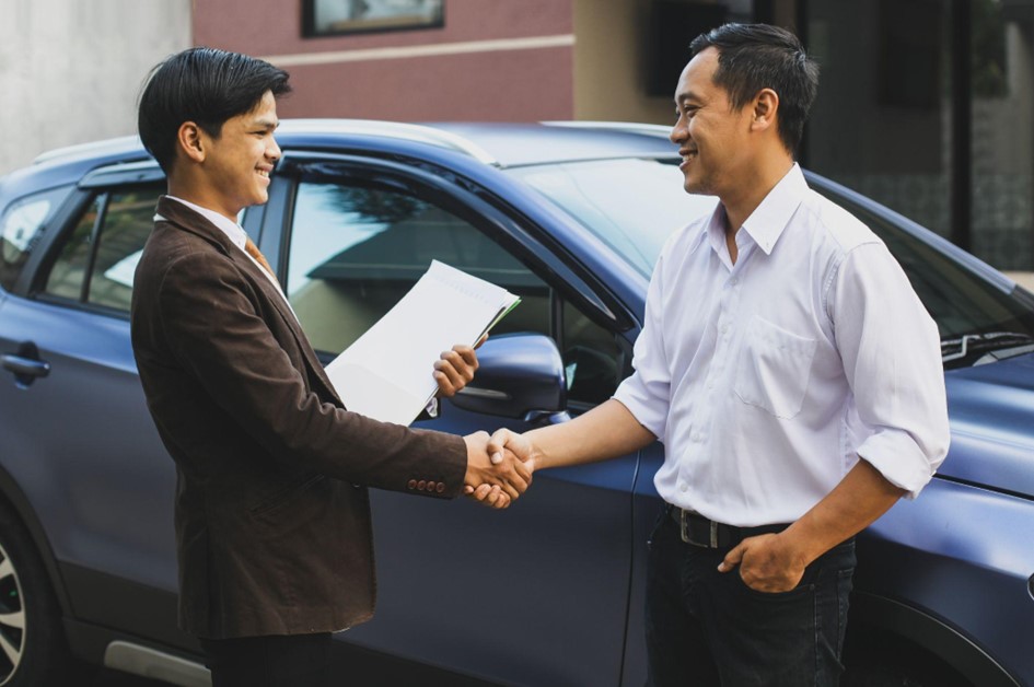 Car dealership for used vehicle ownership transfer