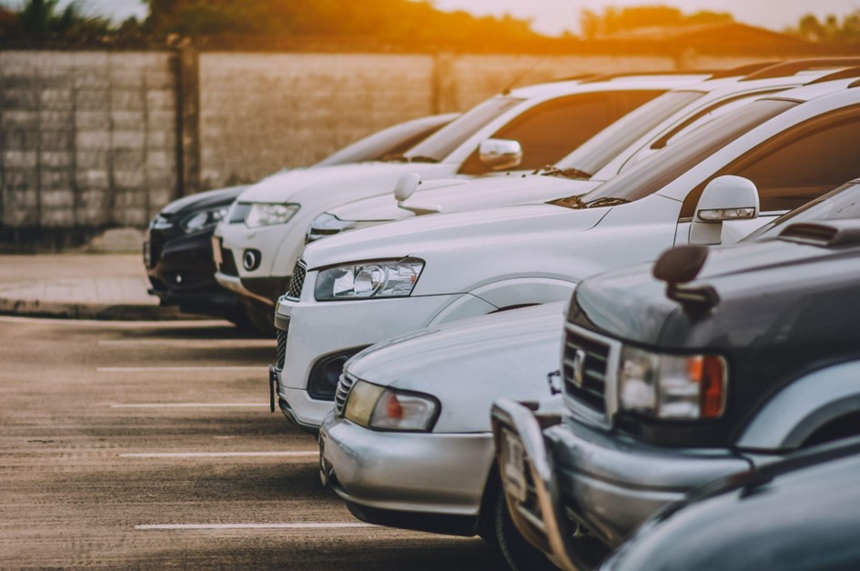 Cars lining up in a row at a used car dealership