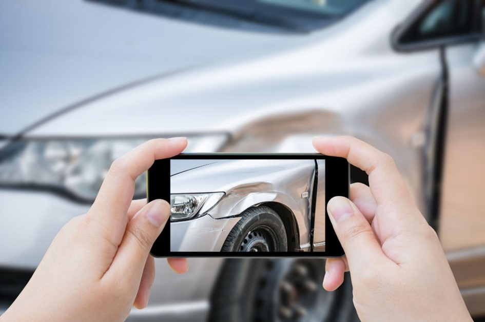 Taking photos of car damages after an accident